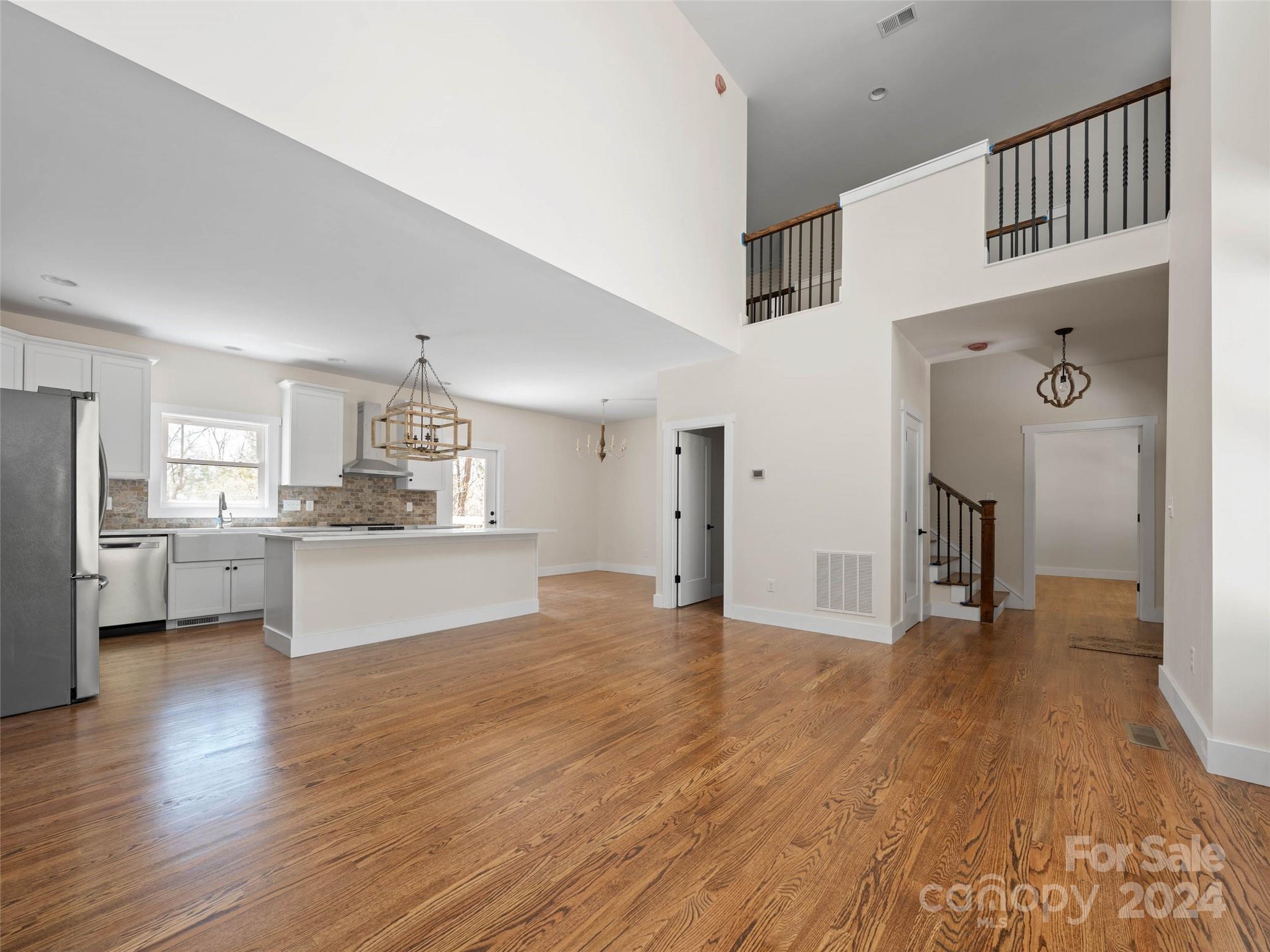 359 Tiptop Road Brevard, NC 28712 - Photo 11 of 48 a view of a kitchen with wooden floor and a sink