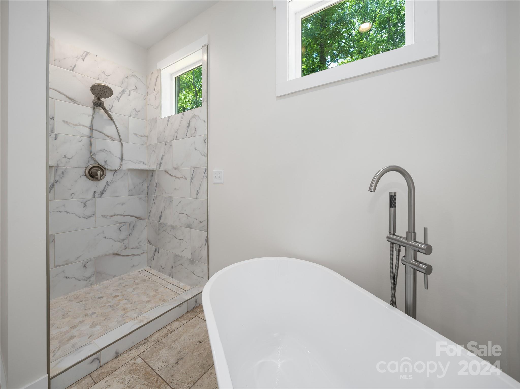 359 Tiptop Road Brevard, NC 28712 - Photo 18 of 48 a bathroom with a sink and a mirror