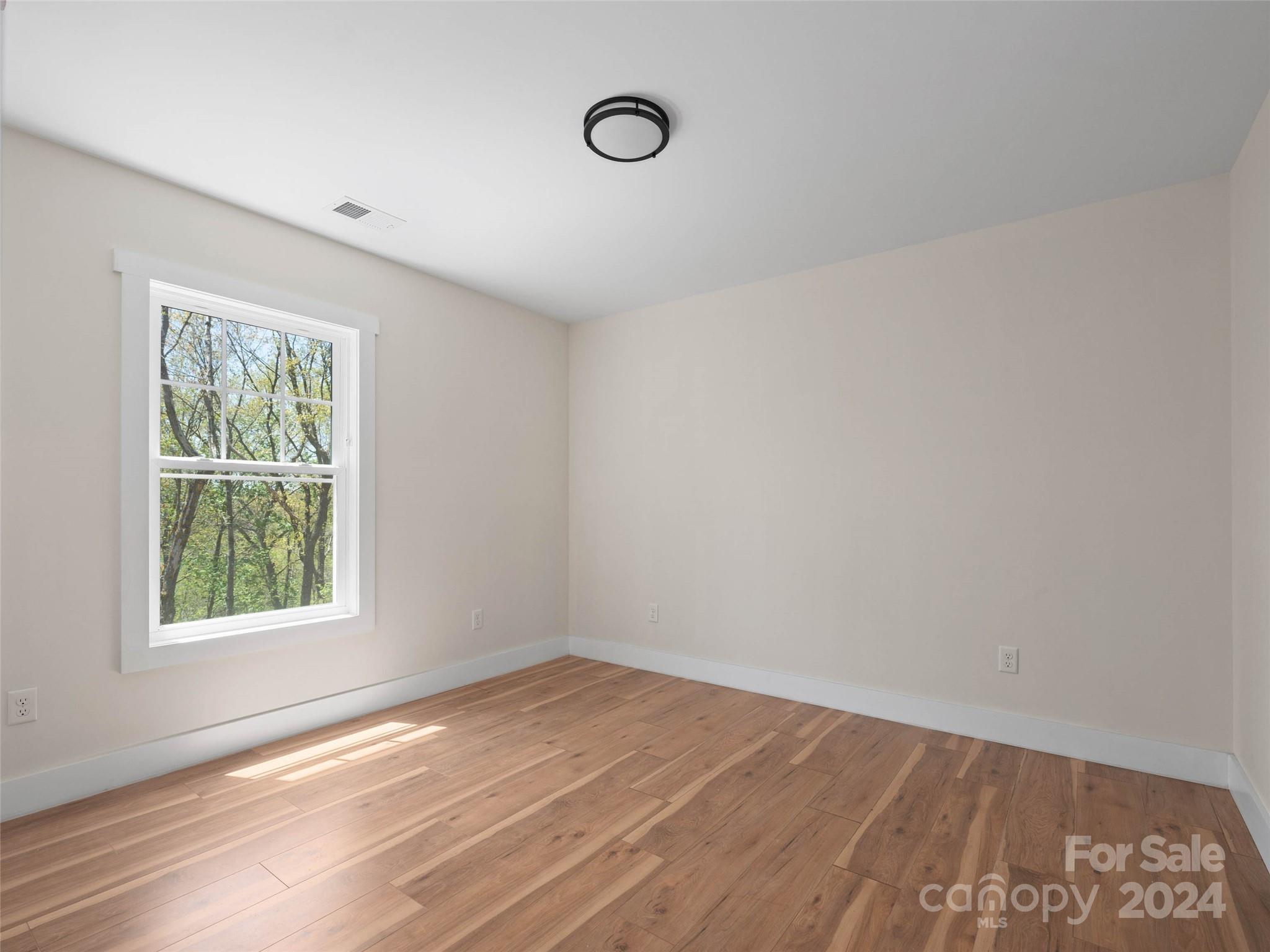 359 Tiptop Road Brevard, NC 28712 - Photo 26 of 48 an empty room with a window