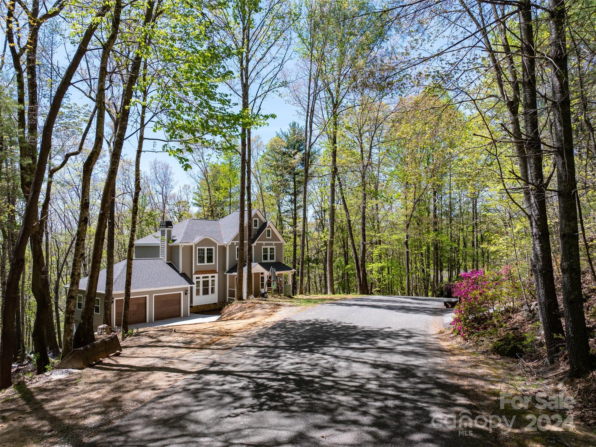 359 Tiptop Road Brevard, NC 28712 - Photo 3 of 48 a front view of a house with a yard and tree s