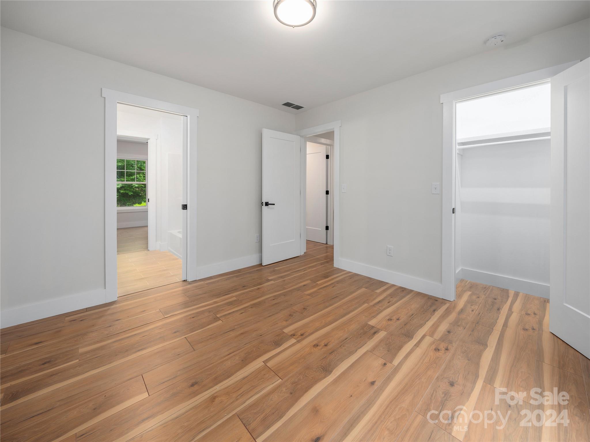 359 Tiptop Road Brevard, NC 28712 - Photo 37 of 48 a view of empty room with wooden floor
