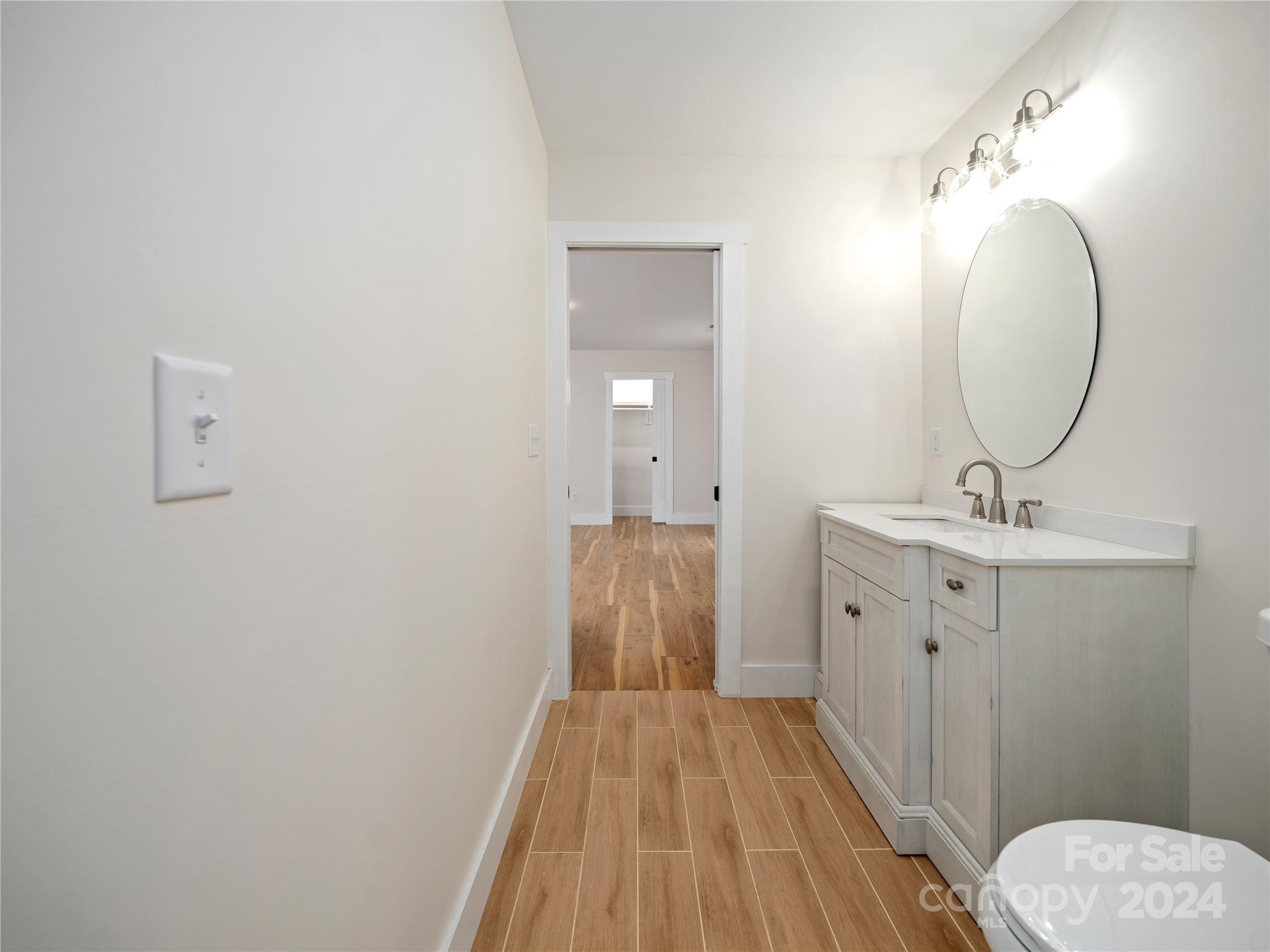 359 Tiptop Road Brevard, NC 28712 - Photo 39 of 48 a bathroom with a sink and mirror