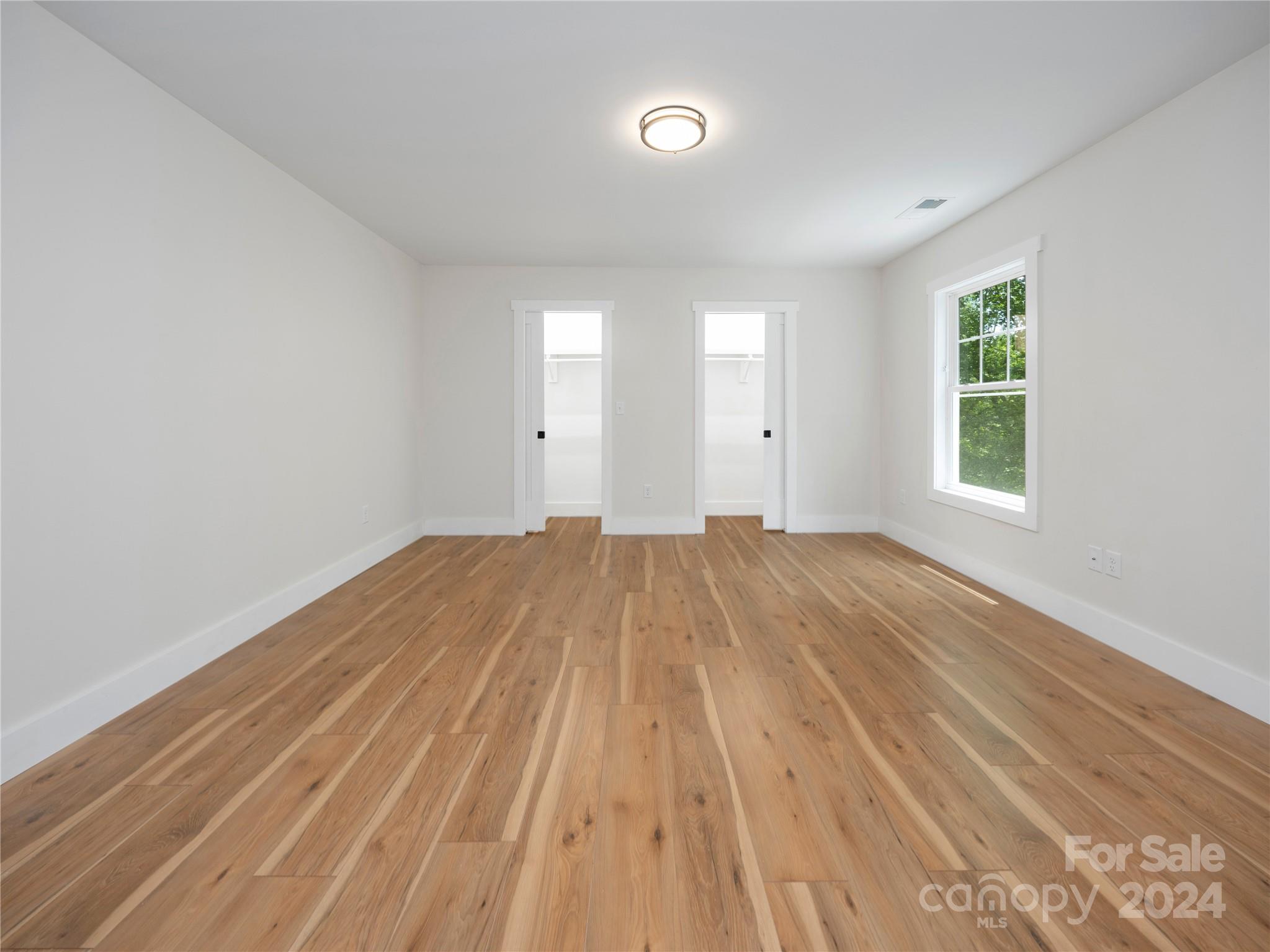 359 Tiptop Road Brevard, NC 28712 - Photo 42 of 48 a view of a room with wooden floor and window