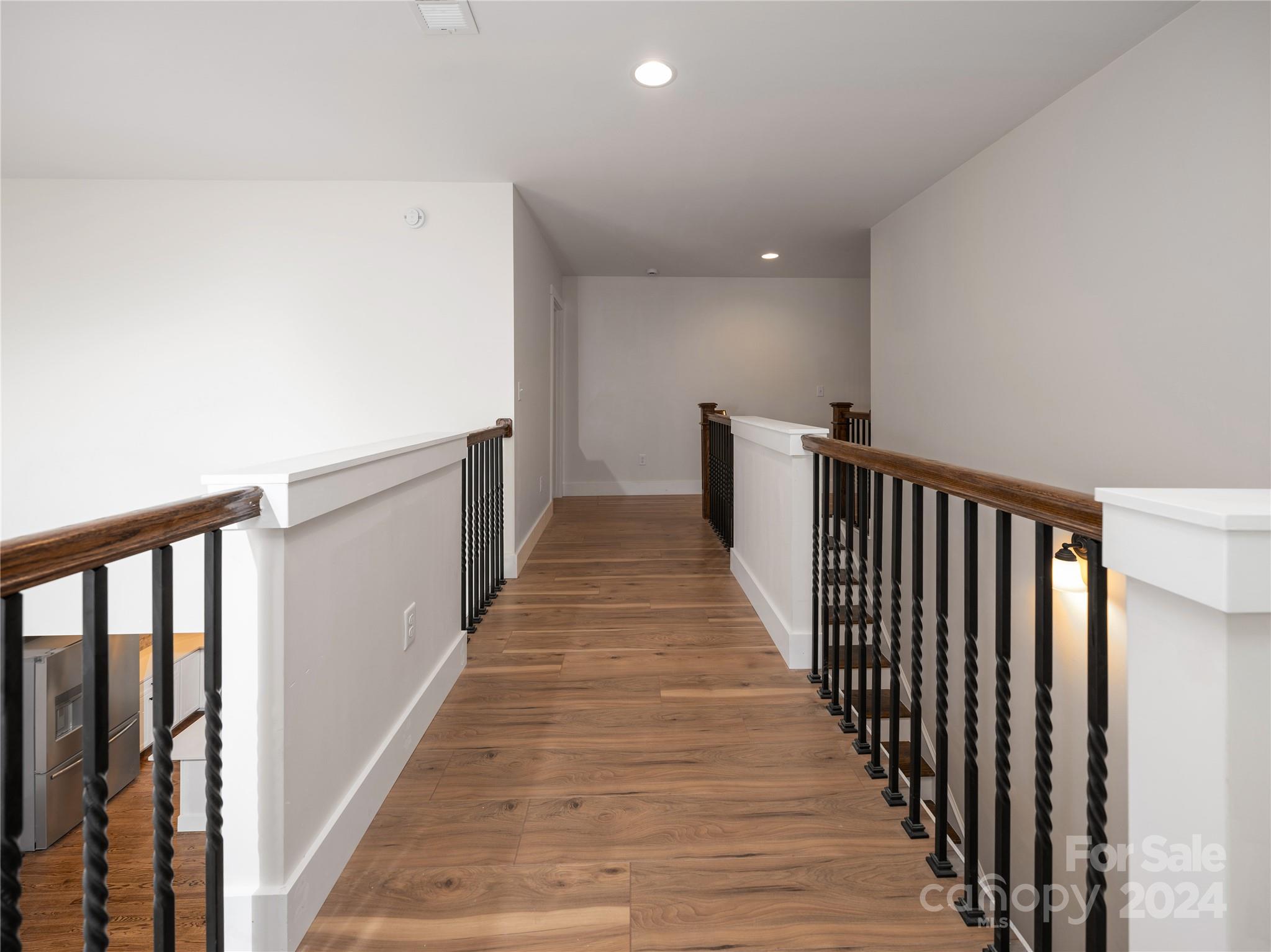 359 Tiptop Road Brevard, NC 28712 - Photo 43 of 48 a view of a hallway with wooden floor
