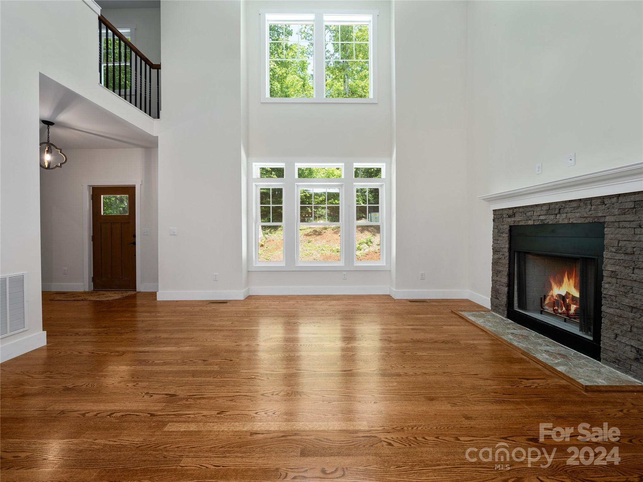 359 Tiptop Road Brevard, NC 28712 - Photo 5 of 48 a view of an empty room with window and fire place