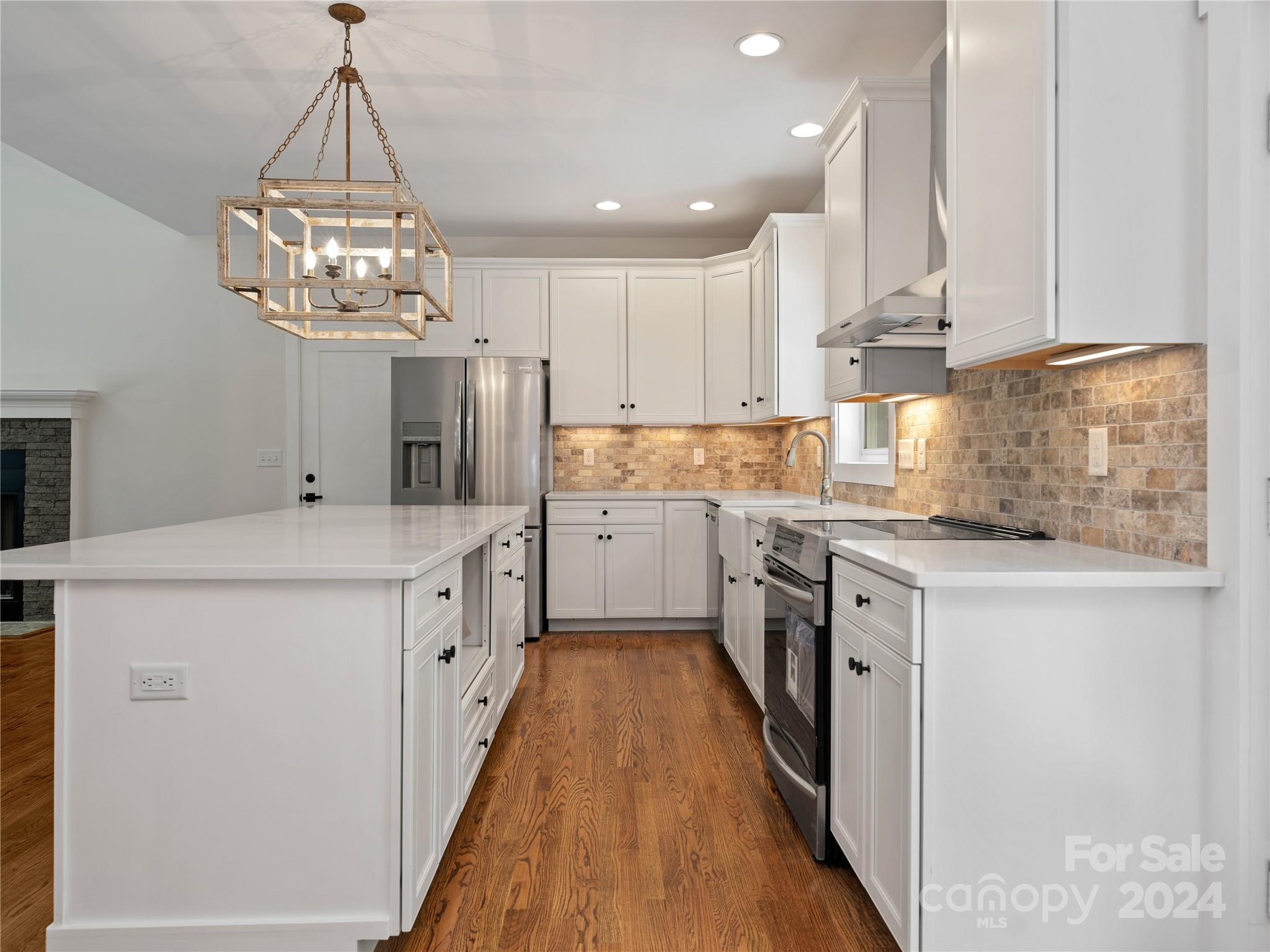 359 Tiptop Road Brevard, NC 28712 - Photo 7 of 48 a kitchen with kitchen island granite countertop lots of counter top space and stainless steel appliances