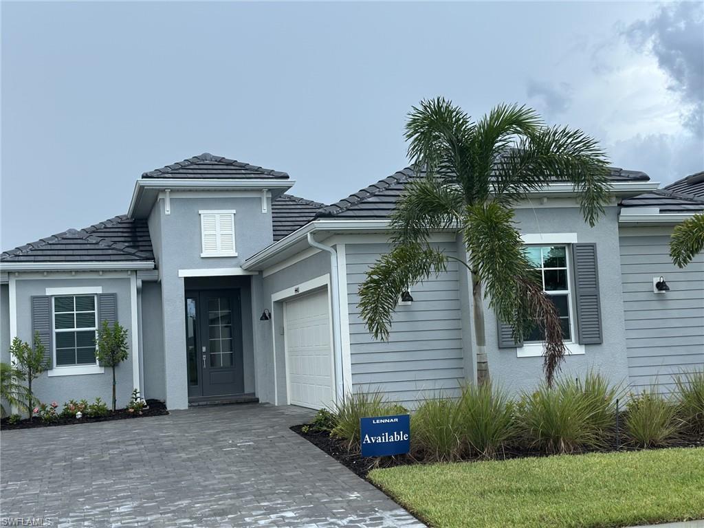 44403 Mesquite Lane Babcock Ranch, FL 33982 - Photo 1 of 1 a front view of a house with a garden