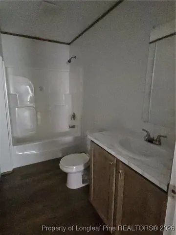 a bathroom with a sink and toilet