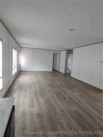 a view of an empty room and window
