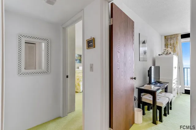 a bedroom with a bed and lamps