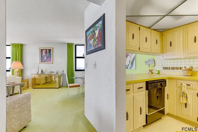 a kitchen with stainless steel appliances granite countertop a sink and cabinets
