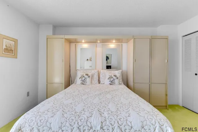 a view of a balcony with next to a yard