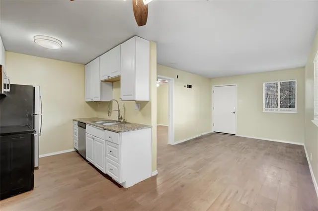 a kitchen with stainless steel appliances granite countertop a stove and a refrigerator