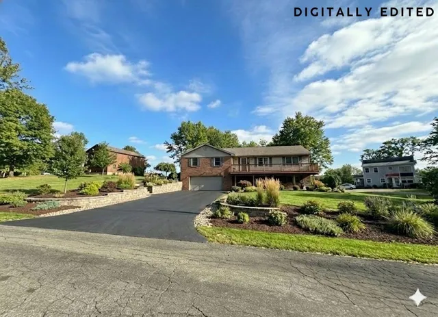 a view of a big house with a big yard