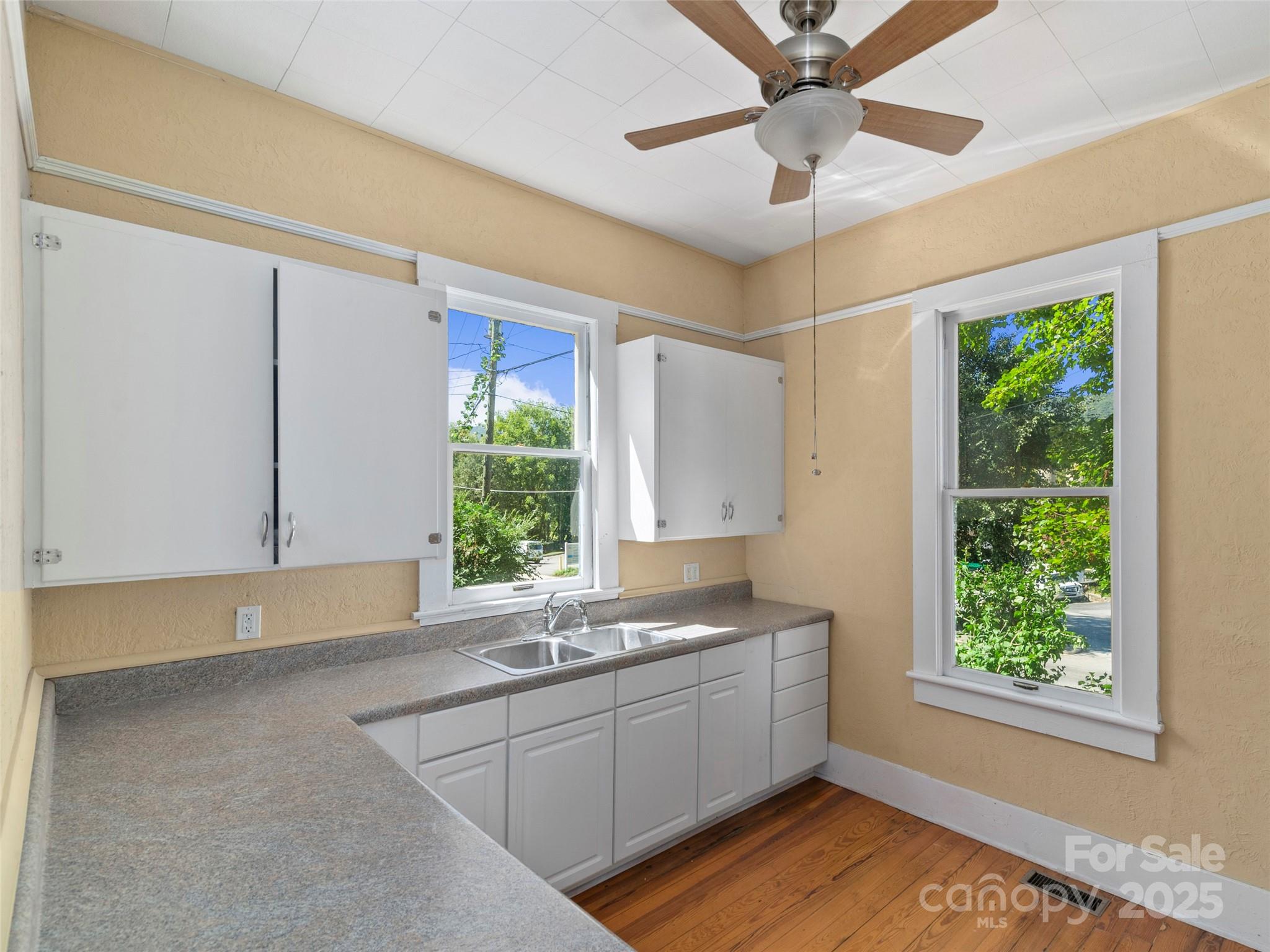 99 Walnut Street Waynesville, NC 28786 - Photo 14 of 34 a kitchen with a sink and a window