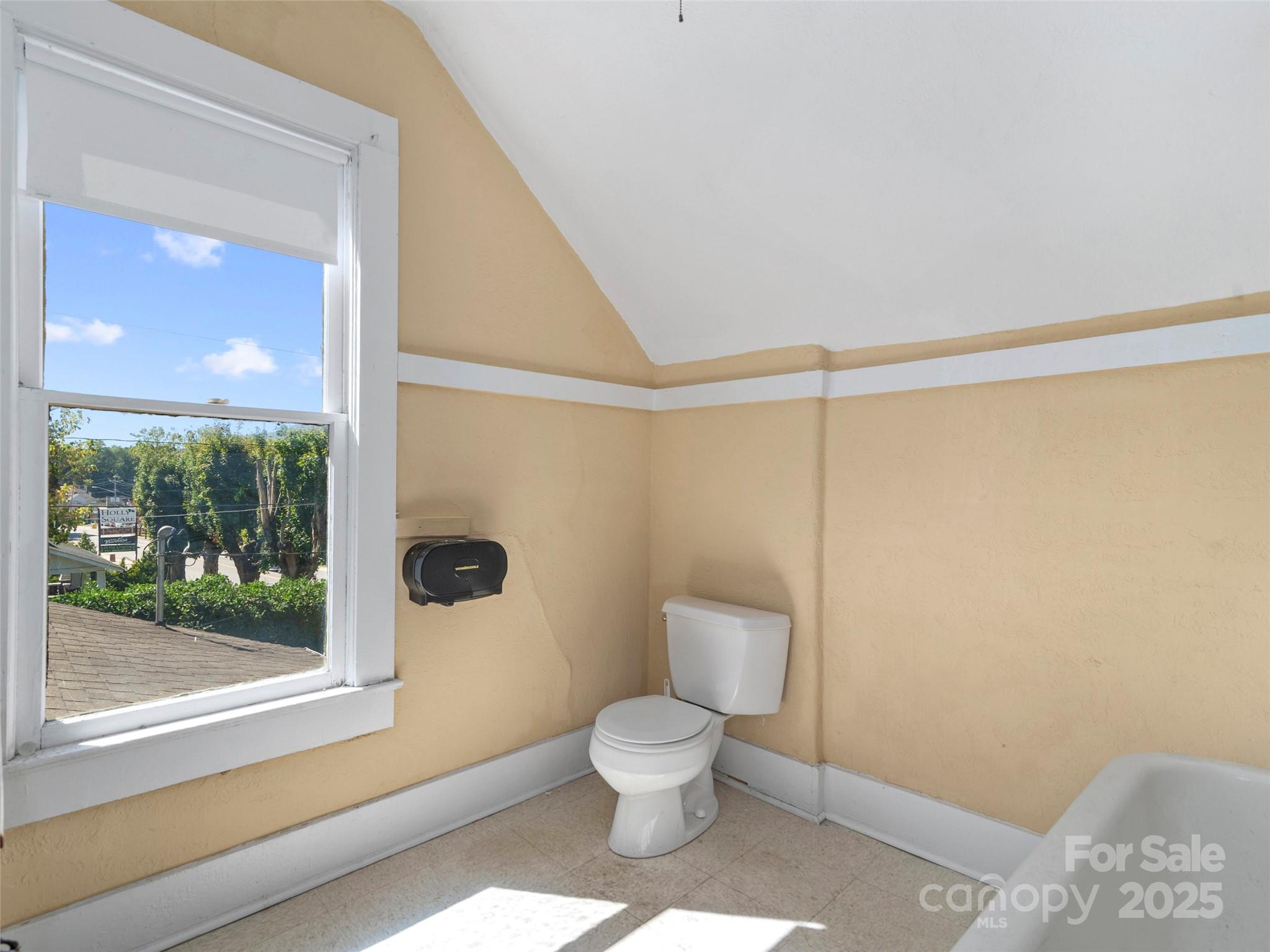 99 Walnut Street Waynesville, NC 28786 - Photo 21 of 34 a bathroom with a toilet a sink and a shower