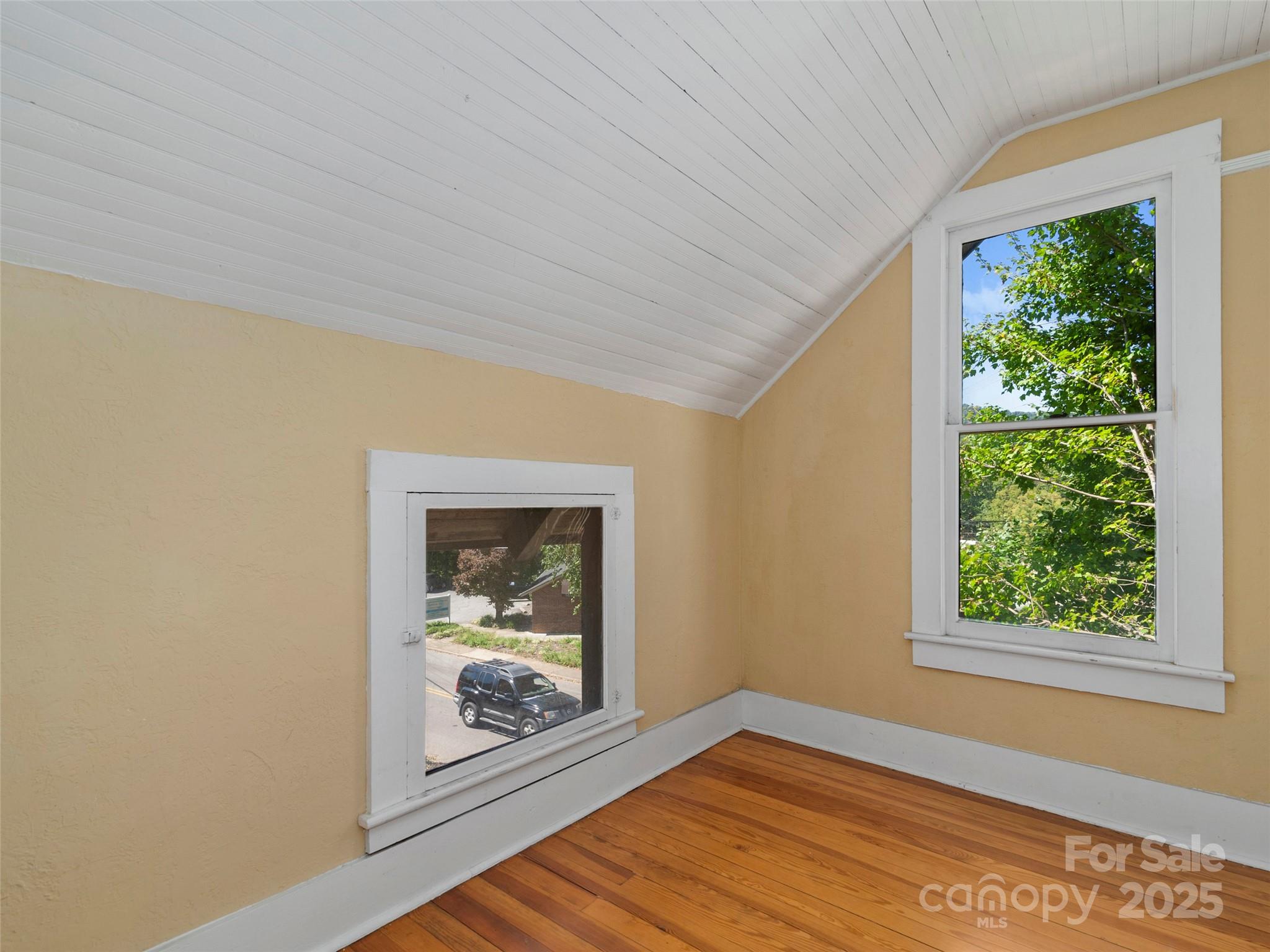 99 Walnut Street Waynesville, NC 28786 - Photo 22 of 34 a view of an empty room with a window
