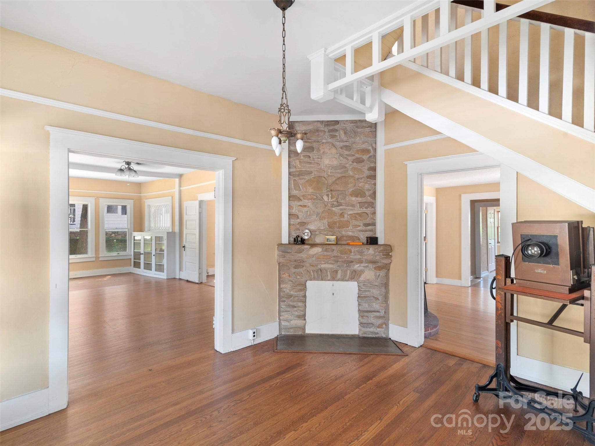 99 Walnut Street Waynesville, NC 28786 - Photo 5 of 34 a view of a livingroom with wooden floor and furniture