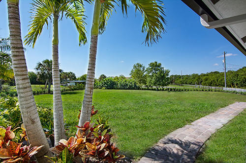 9362 154th Road North Jupiter, FL 33478 - Photo 23 of 26 front lawn