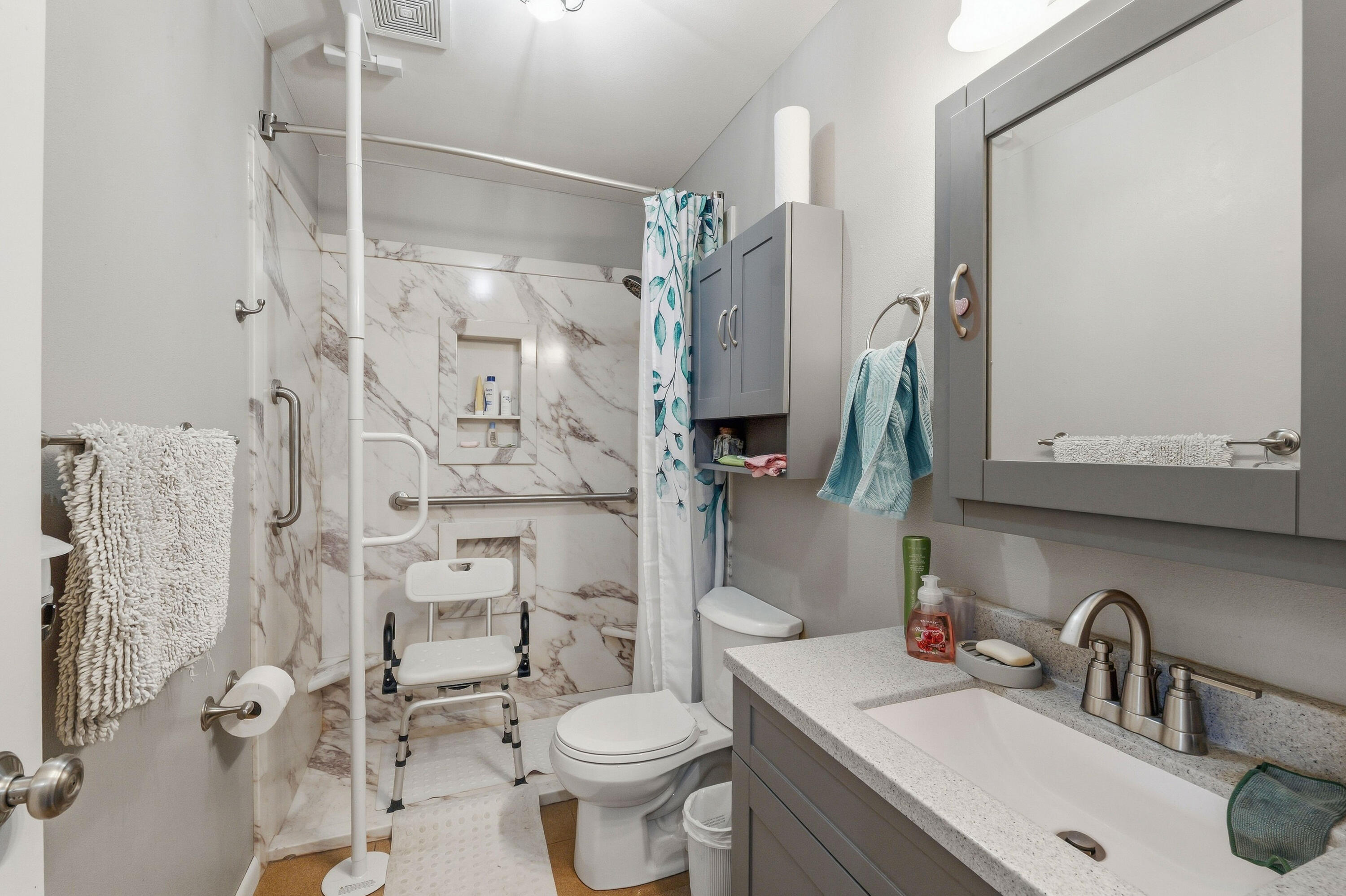 1108 Homestead Road Beaver Dam, WI 53916 - Photo 17 of 42 Updated in 2025 with new vanity, low curb shower, and grab bars