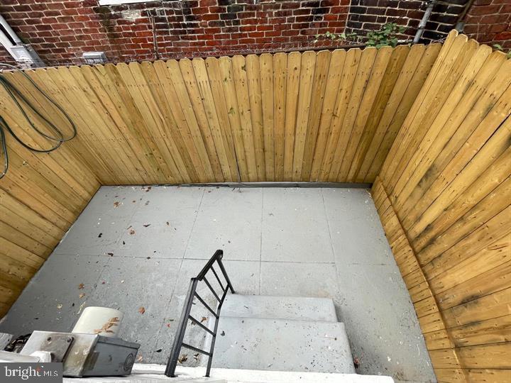 4458 North 20th Street Philadelphia, PA 19140 - Photo 14 of 14 Private outdoor retreat with wooden fencing.