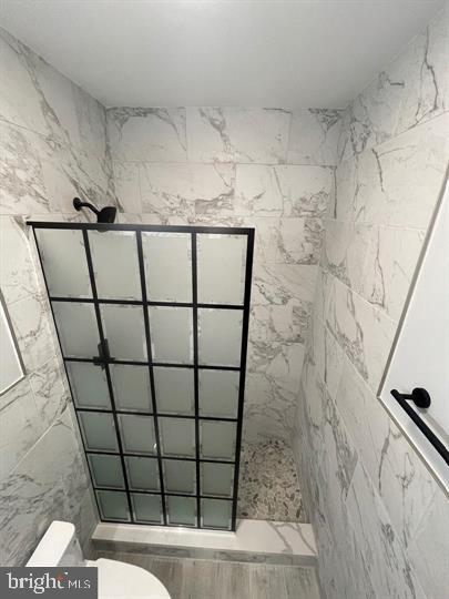 4458 North 20th Street Philadelphia, PA 19140 - Photo 6 of 14 Sleek modern shower with elegant marble tiles.
