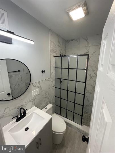 4458 North 20th Street Philadelphia, PA 19140 - Photo 7 of 14 Sleek modern bathroom with elegant finishes.