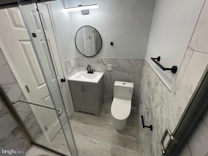 4458 North 20th Street Philadelphia, PA 19140 - Photo 9 of 14 Sleek modern bathroom with elegant finishes.