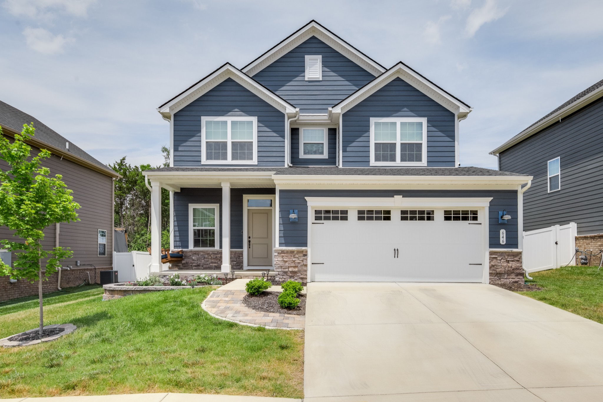 646 Castle Road Mount Juliet, TN 37122 - Photo 1 of 31 a front view of a house with a yard and garage