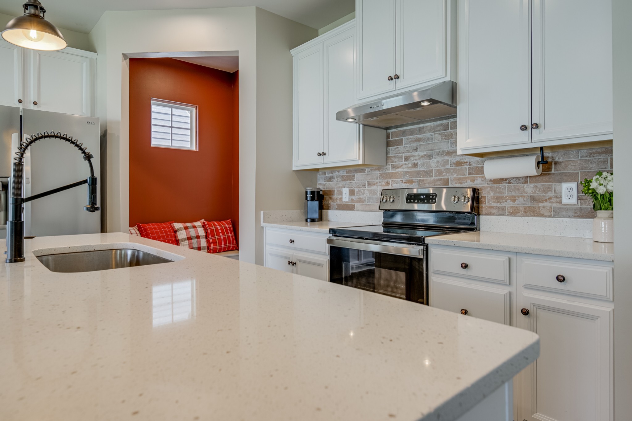 646 Castle Road Mount Juliet, TN 37122 - Photo 11 of 31 a kitchen with stainless steel appliances granite countertop a stove a sink and white cabinets