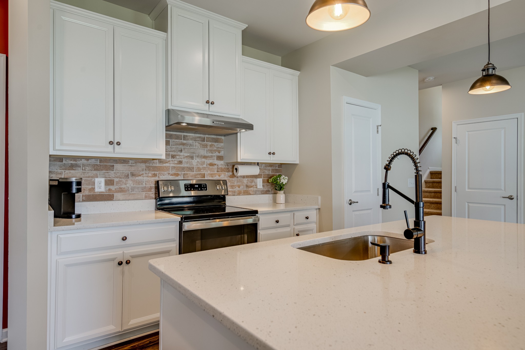 646 Castle Road Mount Juliet, TN 37122 - Photo 13 of 31 a kitchen with granite countertop a stove sink and cabinets