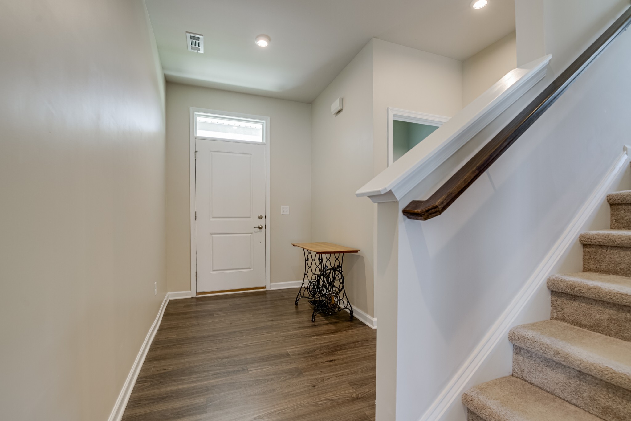 646 Castle Road Mount Juliet, TN 37122 - Photo 17 of 31 a view of a hallway with wooden floor and staircase