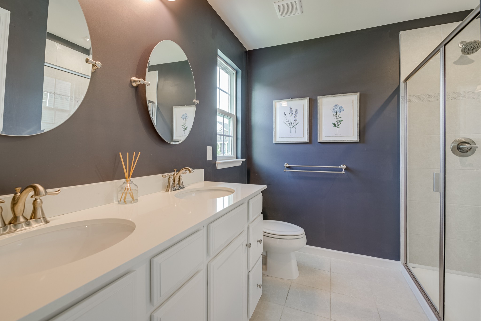 646 Castle Road Mount Juliet, TN 37122 - Photo 21 of 31 a bathroom with a toilet sink and mirror