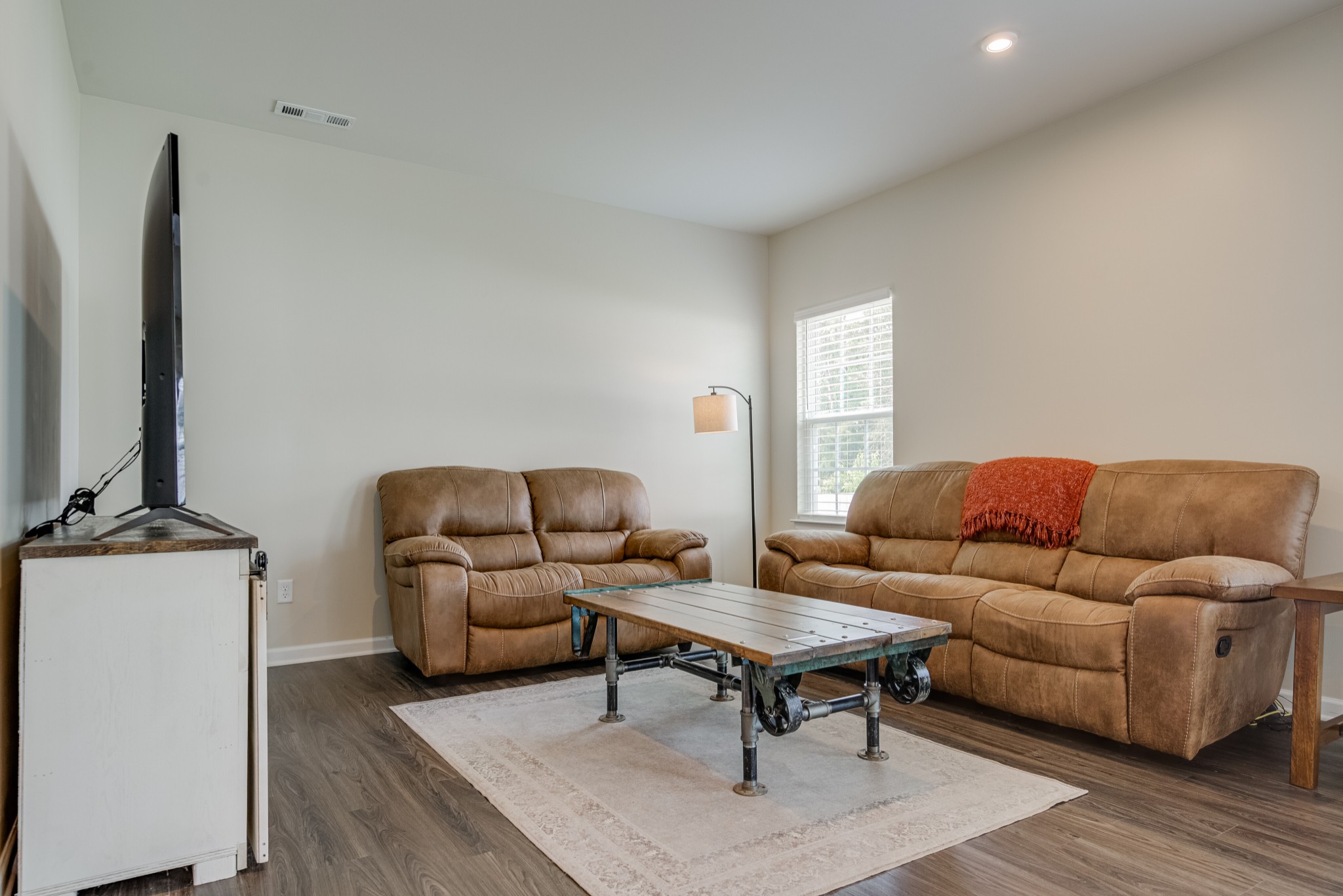 646 Castle Road Mount Juliet, TN 37122 - Photo 8 of 31 a living room with furniture and a flat screen tv