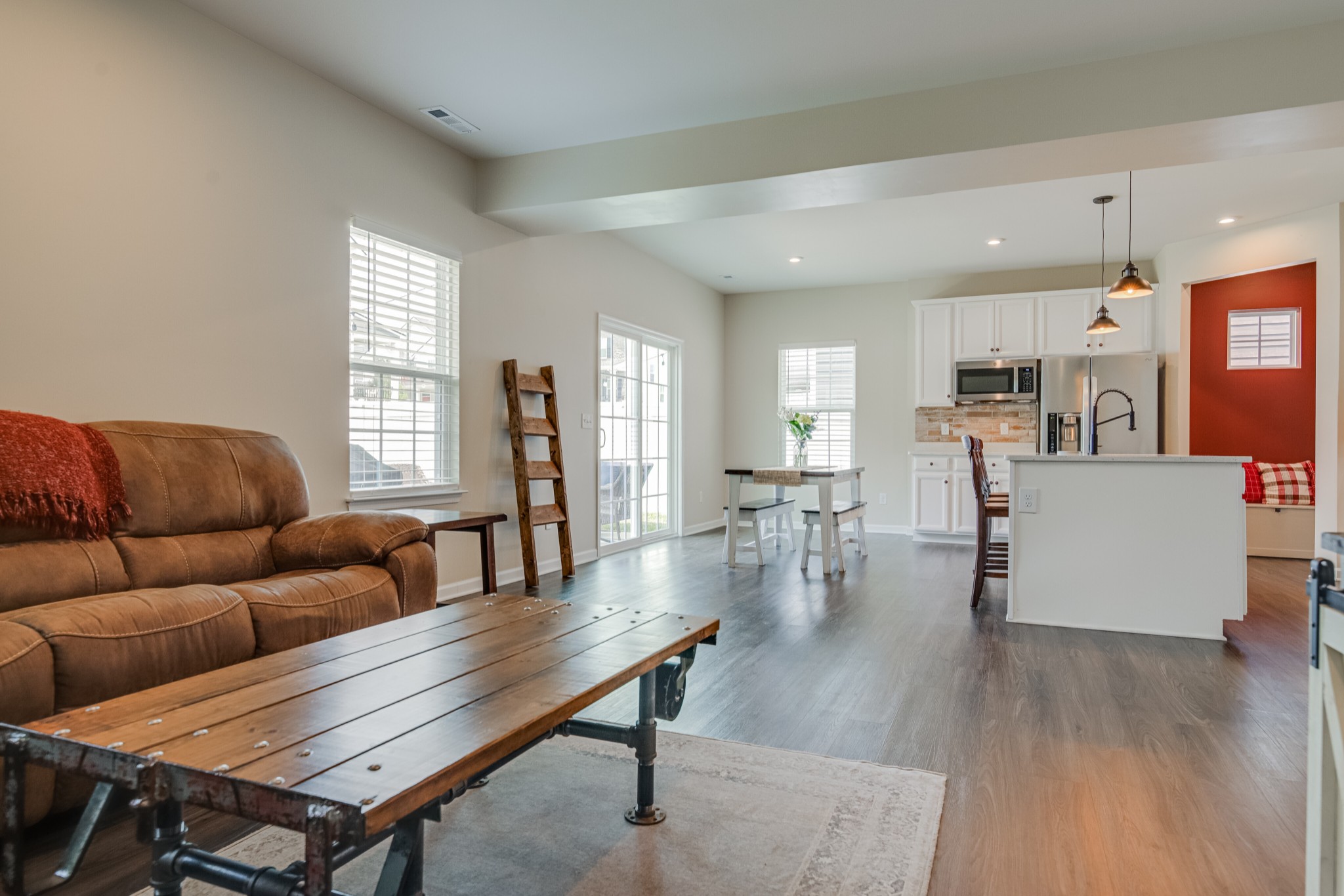 646 Castle Road Mount Juliet, TN 37122 - Photo 9 of 31 a living room with furniture a wooden floor and a large window