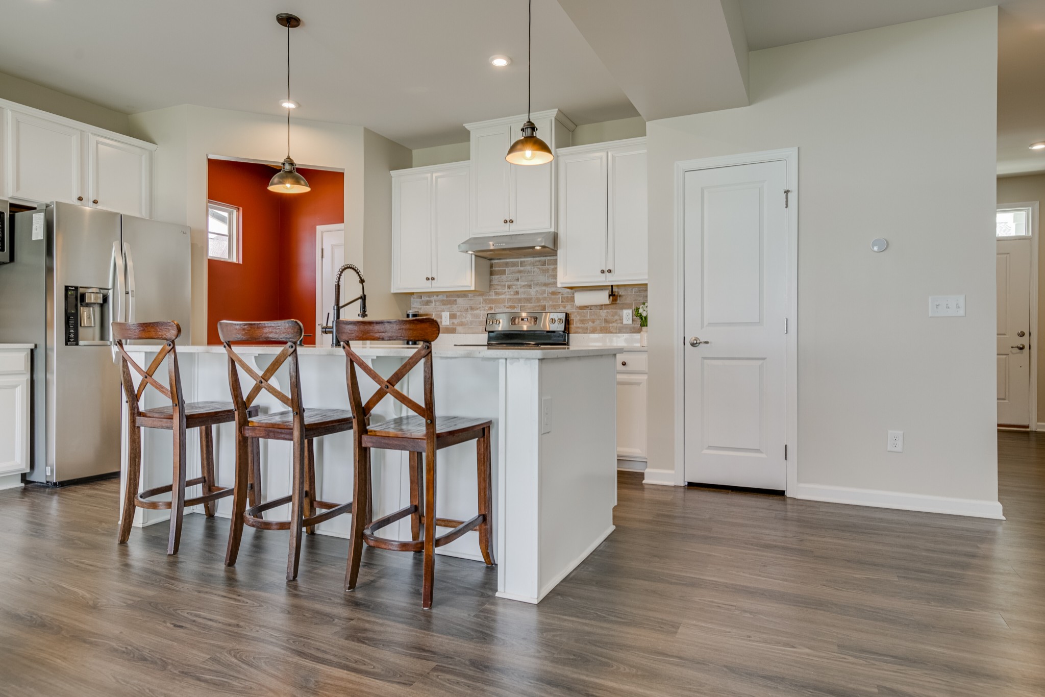 646 Castle Road Mount Juliet, TN 37122 - Photo 10 of 31 a kitchen with stainless steel appliances granite countertop a table chairs refrigerator and microwave