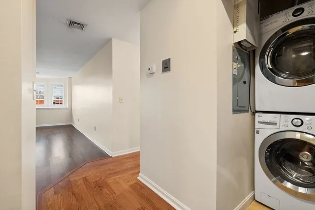 a view of a hallway with washer and dryer