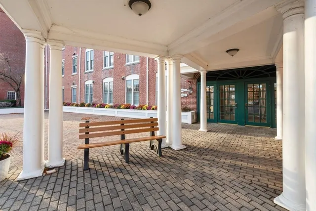 a view of front door with outdoor seating