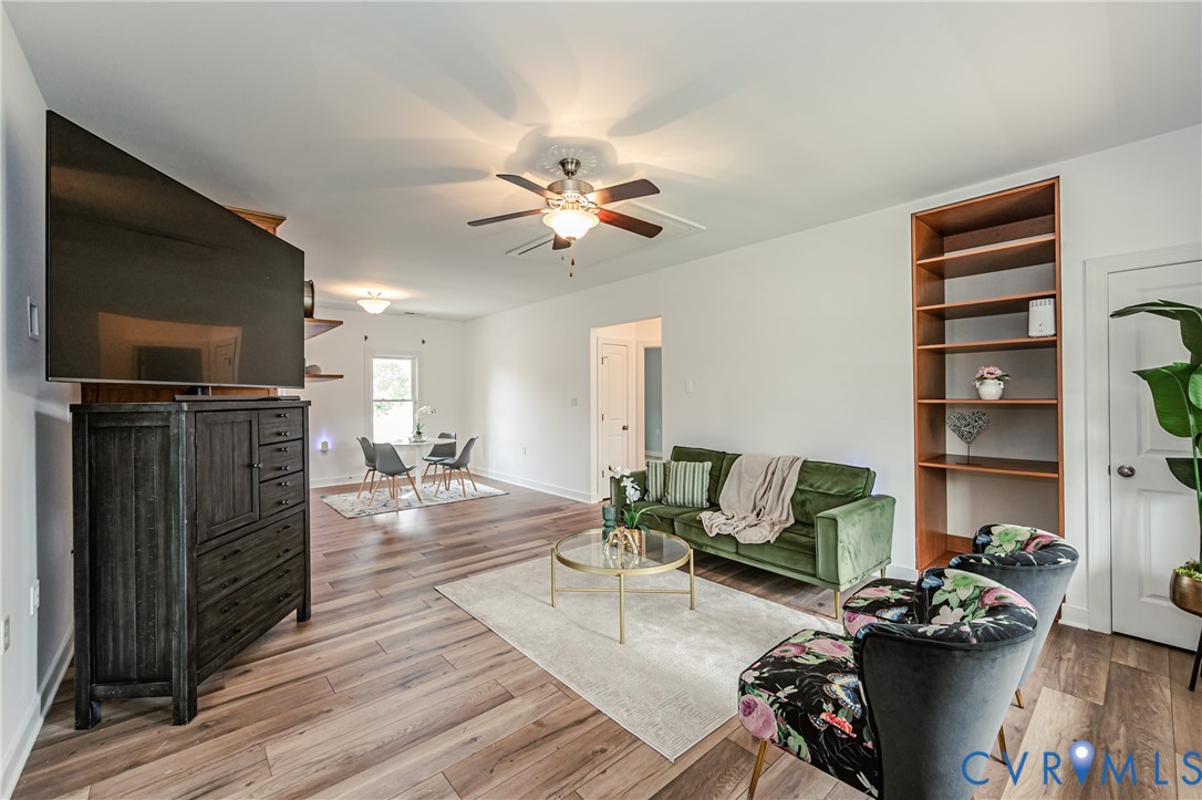 2018 Valentine Road Henrico, VA 23228 - Photo 16 of 65 a living room with furniture a flat screen tv and a fireplace
