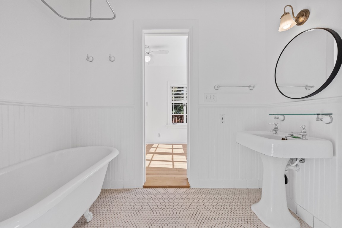516 Lockhart Drive Austin, TX 78704 - Photo 14 of 25 a bathroom with a sink and a mirror