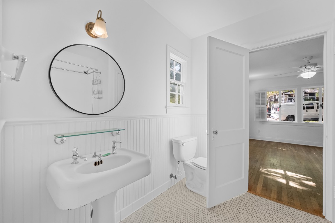 516 Lockhart Drive Austin, TX 78704 - Photo 15 of 25 a bathroom with a sink mirror and toilet
