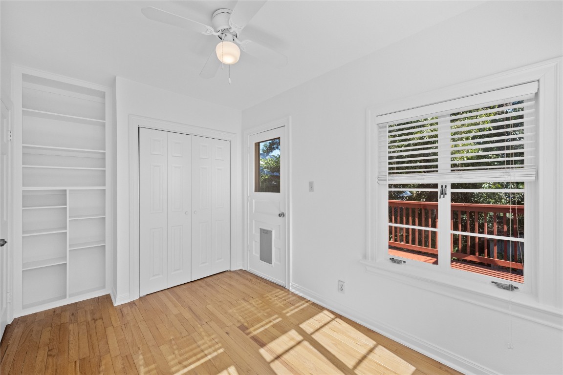 516 Lockhart Drive Austin, TX 78704 - Photo 17 of 25 a view of a bedroom with a balcony and stairs