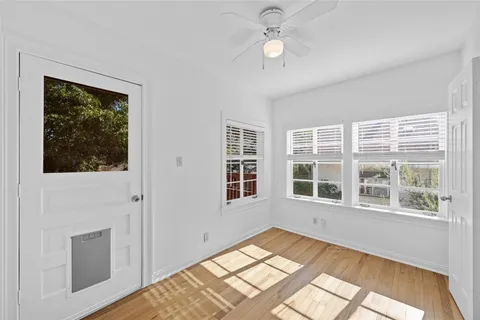 a view of an empty room with a window