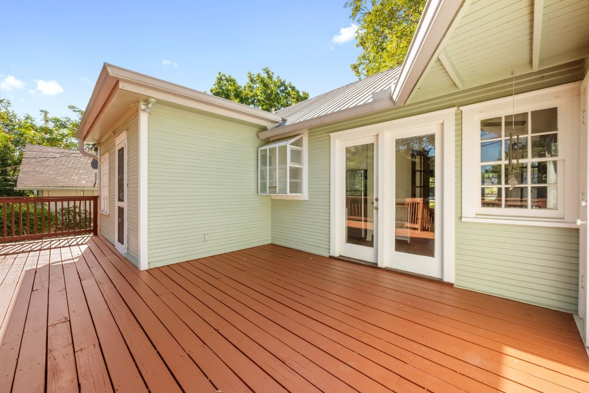 516 Lockhart Drive Austin, TX 78704 - Photo 20 of 25 a view of backyard with a deck and wooden floor