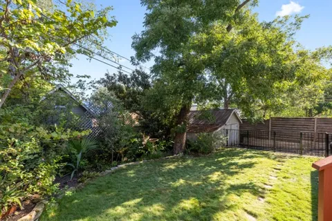 a backyard of a house with swimming pool