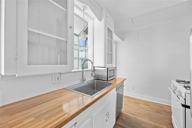 a kitchen with a sink and a window