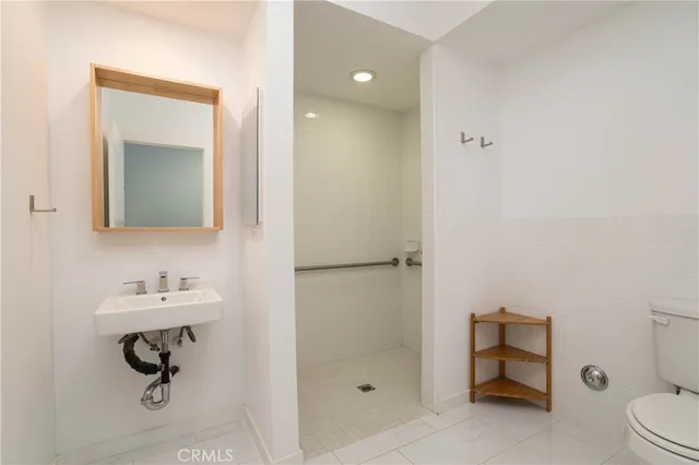 a bathroom with a sink toilet and vanity