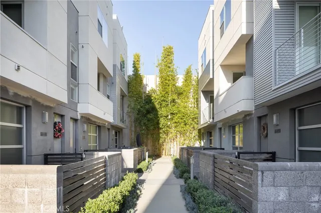 a view of a brick building with many windows