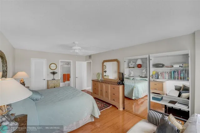 a view of kitchen with refrigerator and window