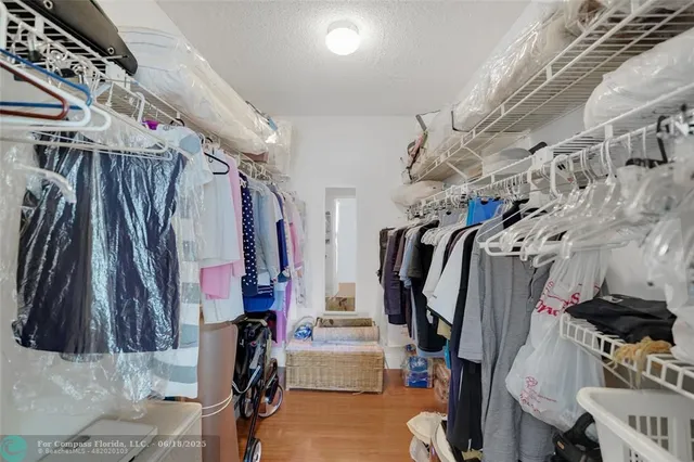 a view of a patio with plants and table